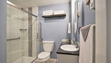 Combined shower/tub, hair dryer, towels, soap