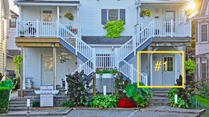 A two-story house with a front porch, a staircase, and a number '1' sign. - ❤️ Perfect for traveling nurses! - Wifi, AC, 4-6 minute commute to Hershey Med (Hummelstown)