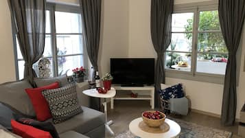 Casa Superior, letti multipli | Soggiorno | TV a schermo piatto 45 pollici con canali via cavo, TV