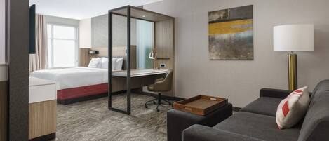 Hypo-allergenic bedding, desk, laptop workspace, blackout drapes