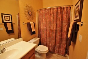 Combined shower/bathtub, hair dryer, towels, soap