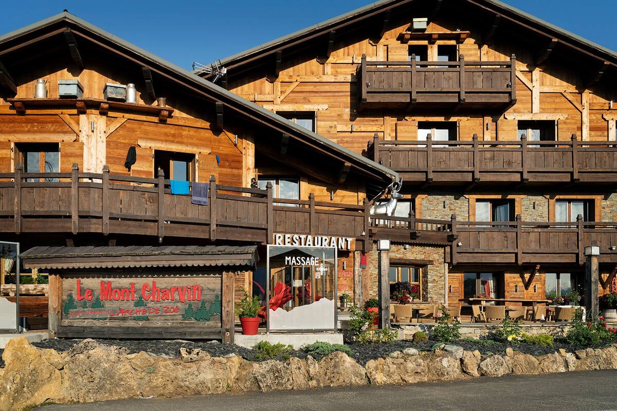 A wooden building with a restaurant and massage service.