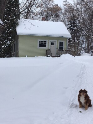 Winter need boots.  About fifty steps to porch from drive way.  Packed path. 