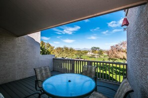 Enjoy a meal or relax on the balcony with a view of the golf course and distant mountains.