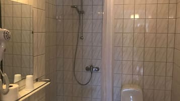 Shower, hair dryer, towels, toilet paper
