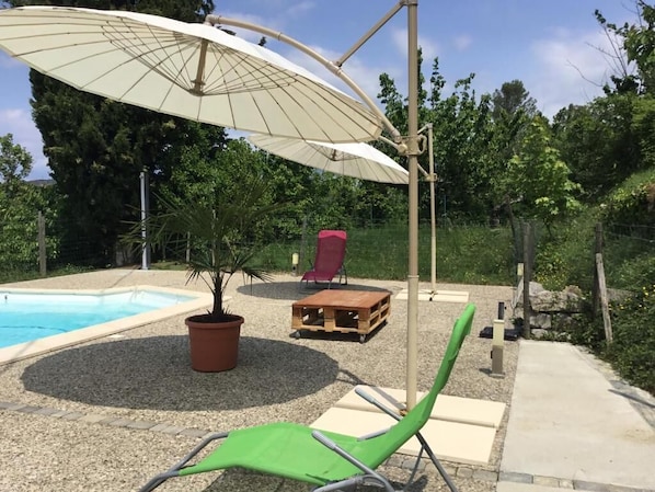 Seasonal outdoor pool, pool umbrellas, pool loungers