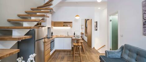 Evlimeni Suites (1st Floor) | Living area | 26-inch Smart TV with satellite channels, TV, Netflix