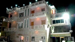 A multi-story building with a sign reading "Motel Grace." - Hotel Grace (Gwalior)