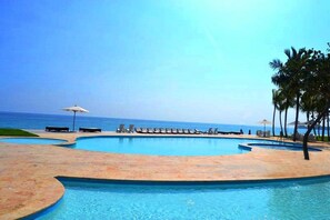 Outdoor pool, a heated pool - 2 Bedroom SeaWinds Oceanfront Luxury Penthouse Cabarete, beach,  private rooftop (Cabarete)