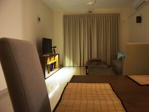 3-Bedroom Apartment | Living area | 43-inch Smart TV with cable channels, TV