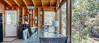 Lakefront cottage with dock, screened porch, & Island in Biscay Pond