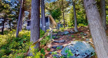 Lakefront cottage with dock, screened porch, & Island in Biscay Pond