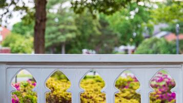 A white wooden fence with decorative cutouts.