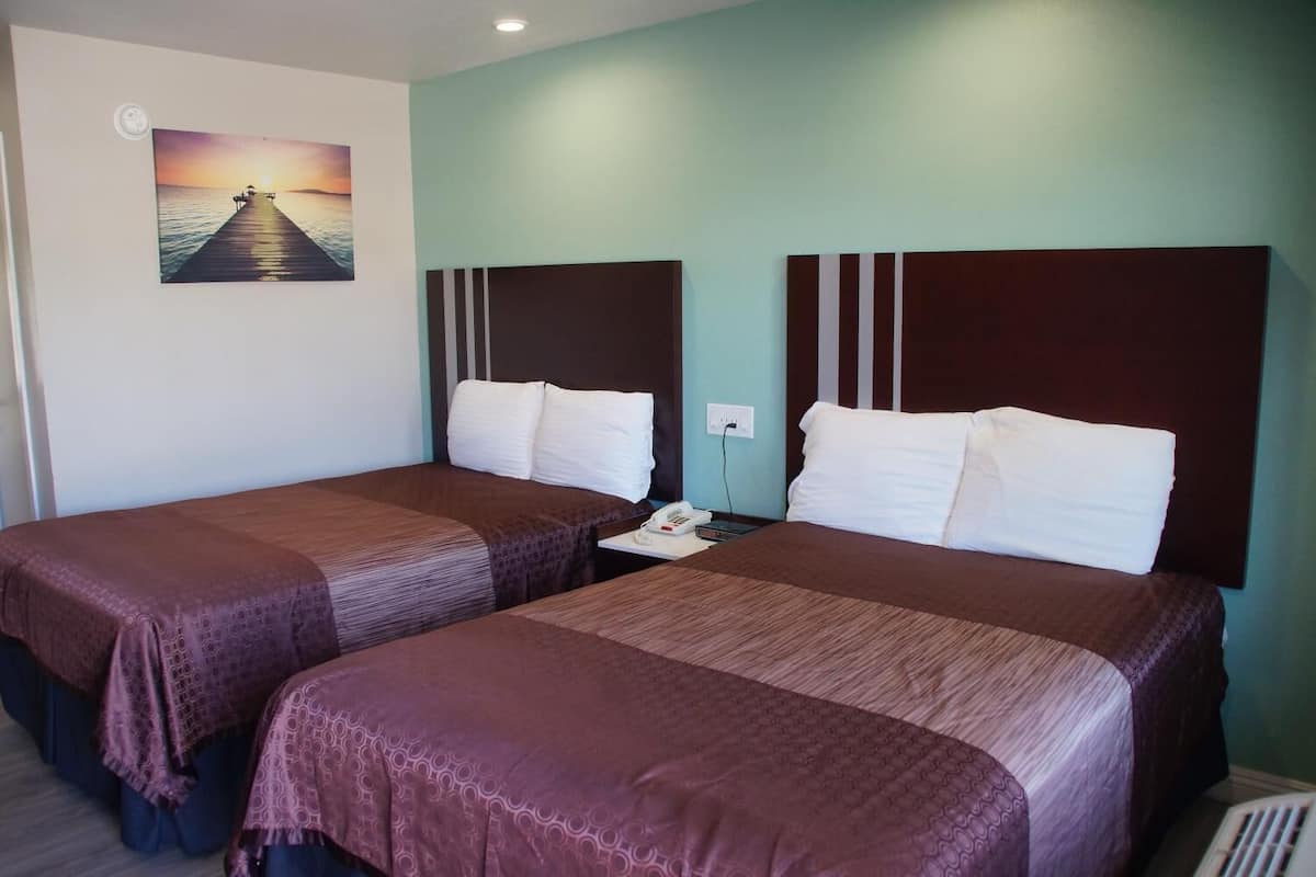 pillow-top beds, desk, laptop workspace, iron/ironing board