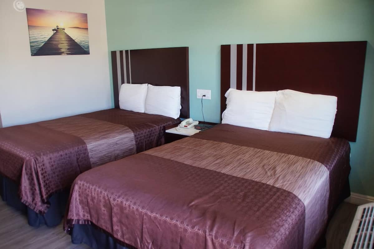 pillow-top beds, desk, laptop workspace, iron/ironing board