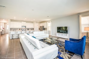 Villa, varias camas | Área de sala de estar