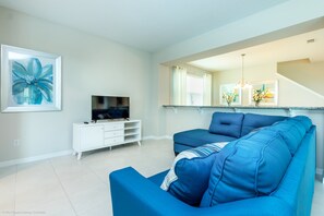 Villa, varias camas | Área de sala de estar