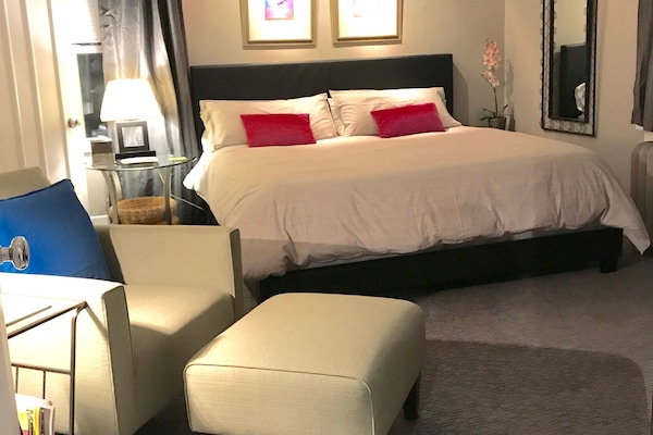 Very spacious bedroom with king bed, Smart TV and lounge chair