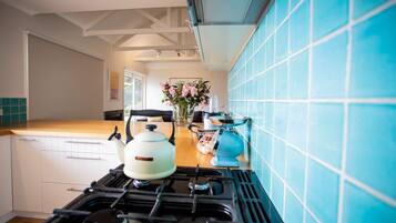 Microwave, dishwasher, coffee/tea maker, cookware/dishes/utensils