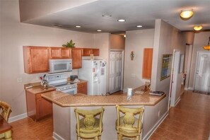 Enjoy cooking in this well-equipped kitchen with a central island and bar-style seating.