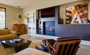 Smart TV, fireplace, table football, books