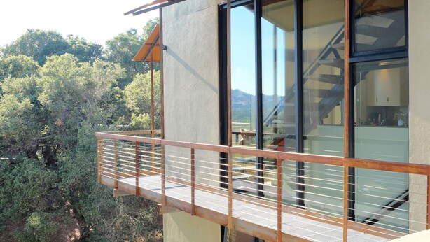 A modern building with large windows and a balcony. - Modern Sonoma Home! Beautiful Views, Hot Tub.  Relax on The Patio, Wine Country! (Sonoma)