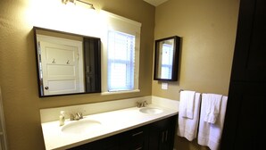 A bathroom with two sinks, a mirror, and a window. - 3 Br Disneyland Home — Sleeps 6-8 (Anaheim)