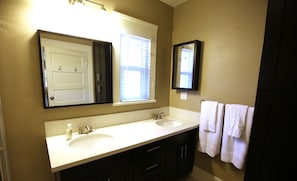Combined shower/tub, hair dryer, towels, soap