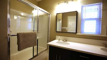 Combined shower/bathtub, hair dryer, towels, soap