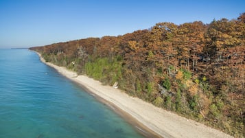 On the beach, sun loungers, beach towels