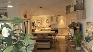 A modern kitchen with a central island, pendant lighting, and a view into the dining area. - Close to Beach, 3 Bed, 2 Bath, Comun. Dock, New Remod! Community Pool! (Jensen Beach)