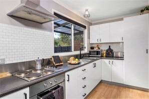 Fridge, microwave, oven, stovetop - Three Beaches - chic eco home a moment from the beach in pristine Tasmania (Eggs and Bacon Bay)