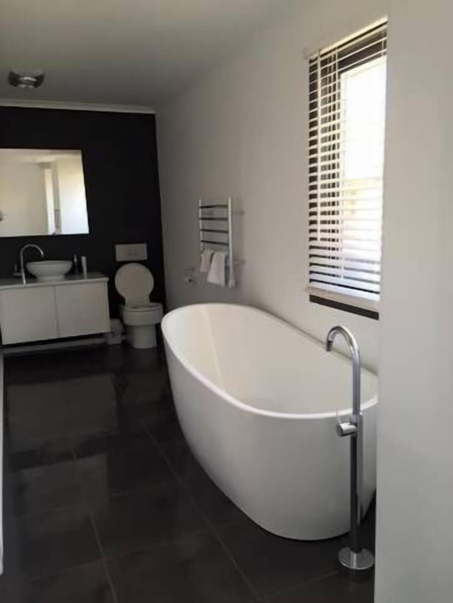 Bathtub, hair dryer, towels, soap