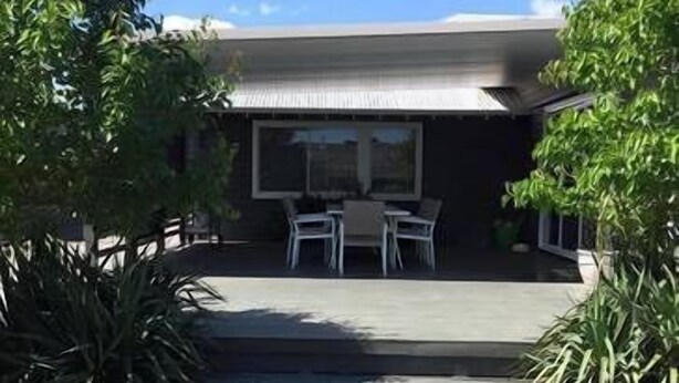 A modern house with a covered patio, two white chairs, and a satellite dish. - Bella Vita @ Yarrawonga (Yarrawonga)