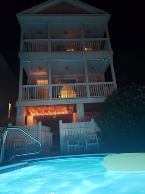 Enjoy the view from the balcony, overlooking the pool and outdoor space.