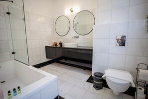 Combined shower/tub, hair dryer, towels, soap