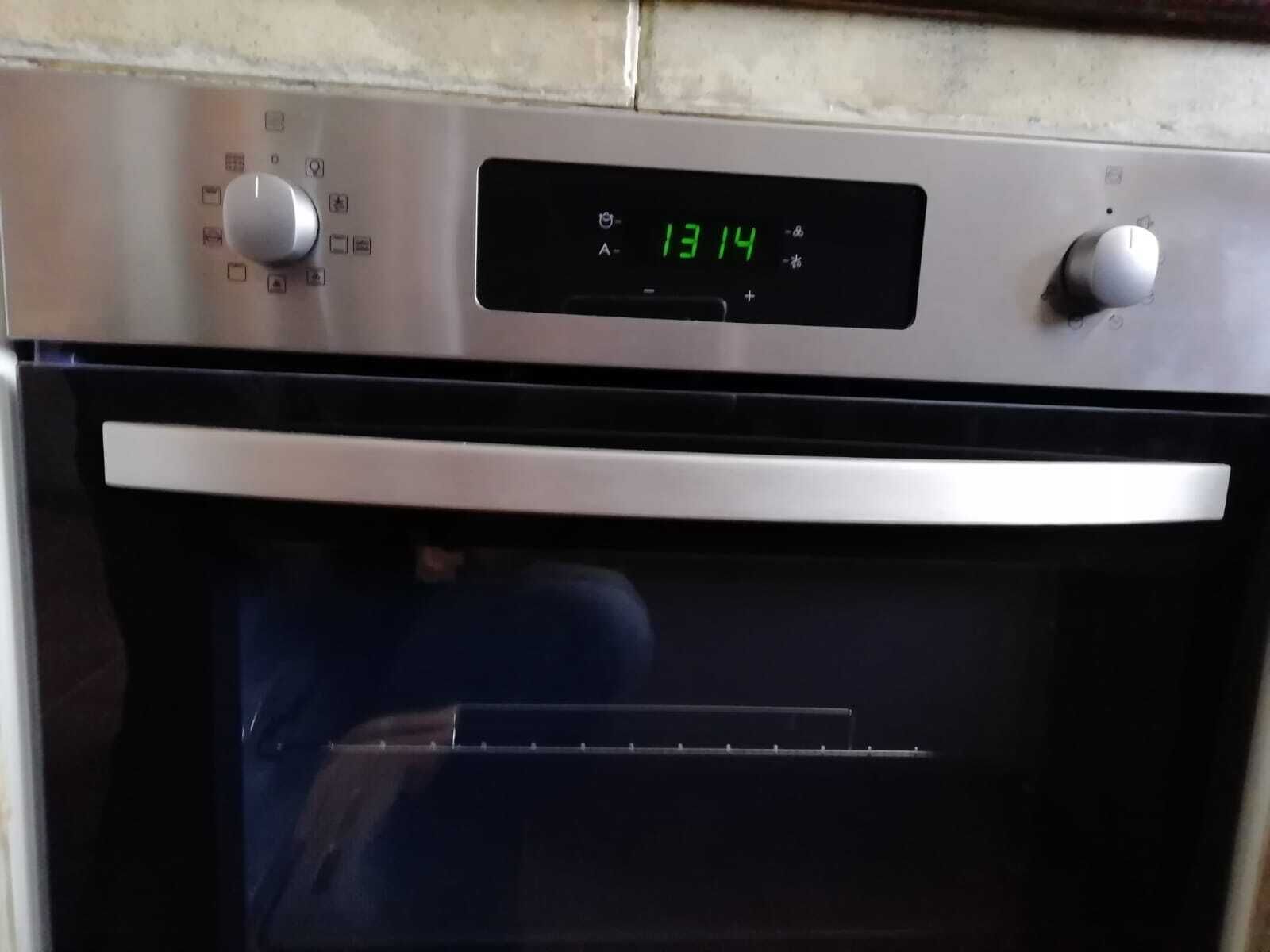 An oven with a digital display showing the temperature as 1314.
