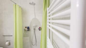 Shower, hair dryer, towels, toilet paper