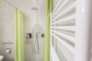 Shower, hair dryer, towels, toilet paper