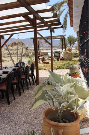 Outdoor dining - Cave houses  sleeping 8 people with swimming pool.  Close to Playas Calnegre.  (Lorca)