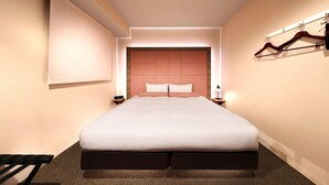 A modern hotel room with a large bed, a bedside table with a lamp, a wall-mounted coat rack, and a large window. - Doutonbori Crystal Hotel (Osaka)