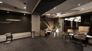 A modern interior with a seating area, tables, and a large window. - Doutonbori Crystal Hotel (Osaka)