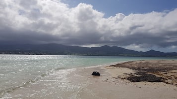 On the beach, sun loungers