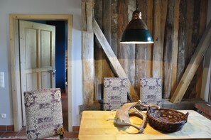 Cozy retreat with a traditional door, simple table, and woven basket.