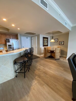 Enjoy meals in the kitchen with an island and dining area featuring a round table and comfortable seating.