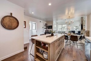 Enjoy cooking in this well-equipped kitchen with a central island, oven, and dining area.