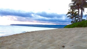 A sandy beach with footprints and a blue object. - BEACH FRONT ESTATE SANDY BEACH Heated Saline Pool 360 Views: Please Inquire (Waialua)