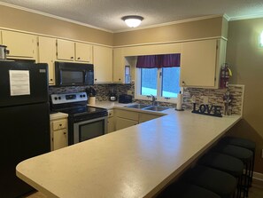 Coffee/tea maker, fridge, microwave, oven