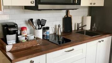 Fridge, microwave, stovetop, coffee/tea maker