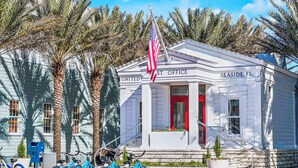 A small white building with a red door labeled "United Post Office" in Seaside, FL. - "Breakers" | 2 Minutes walk to the Beach | Heated community pool | Includes 4 Bikes (Seaside)